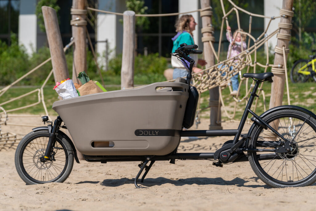 Dolly Joy cargo bike parked outside the playground