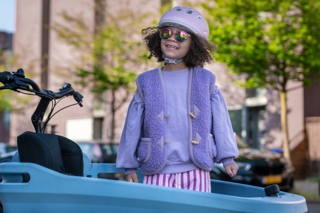 Happy girl in Dolly Joy Blue Raspberry